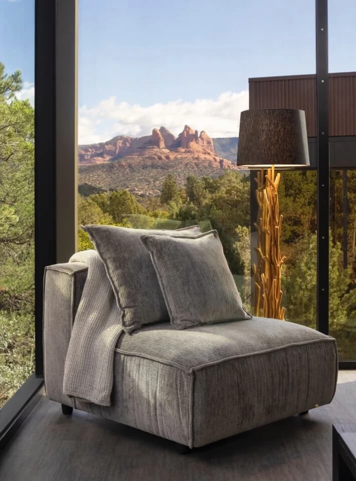 Modern chair with a view of Sedona's red rock mountains in the background.