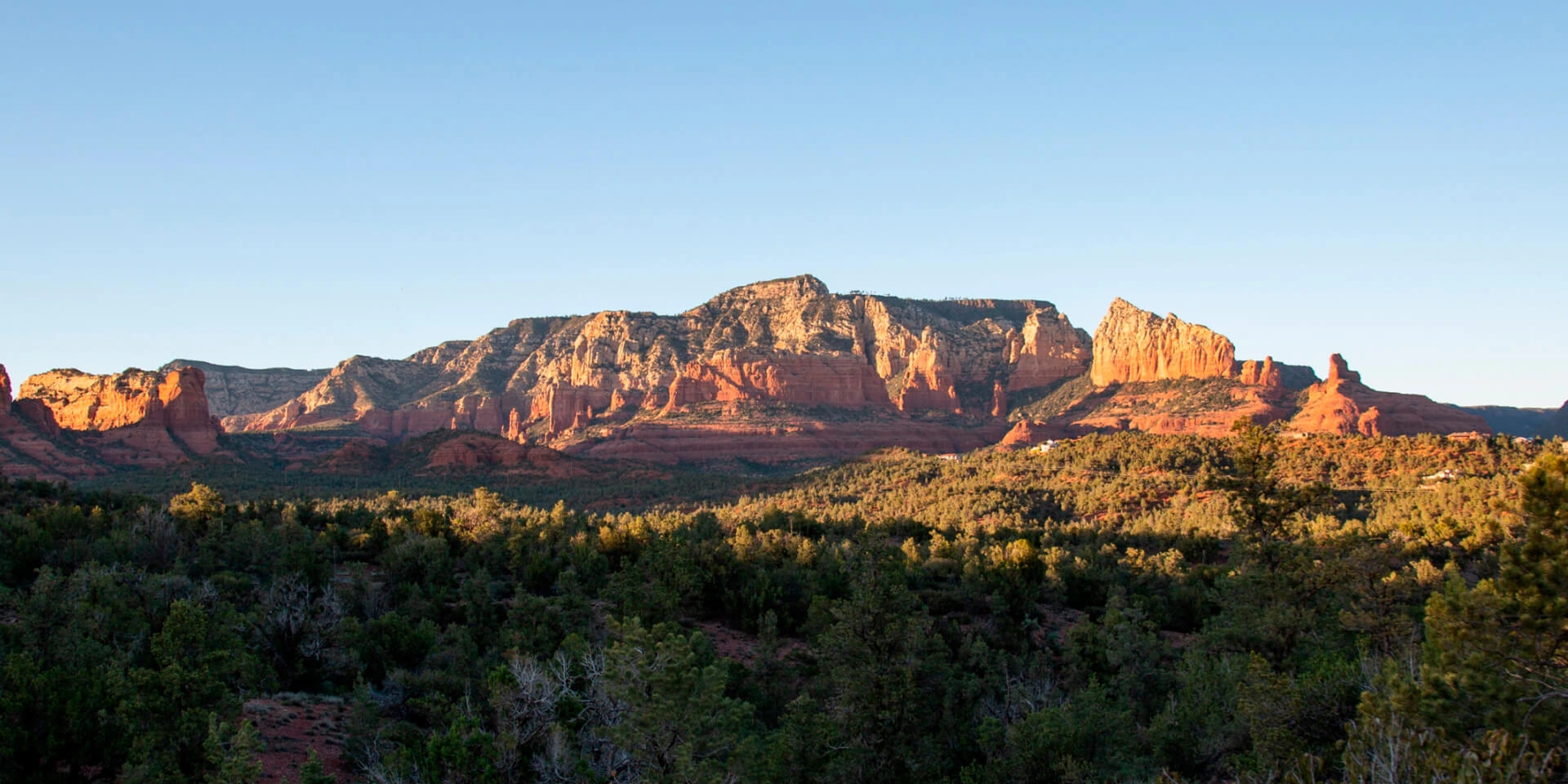 A stunning view of Arizona’s red rocks from a luxurious landscape hotel.