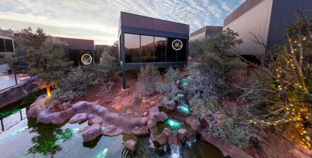 A virtual tour snapshot of a landscape hotel in Sedona, showcasing water features and red rock views surrounding the atriums.