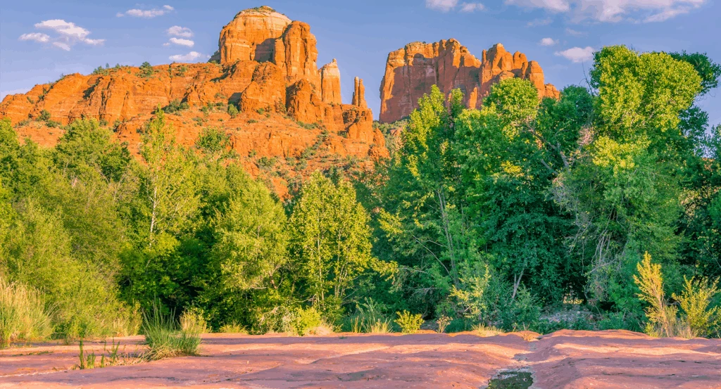 Oak Creek Canyon Sedona with verdant trees and red rock landscape.