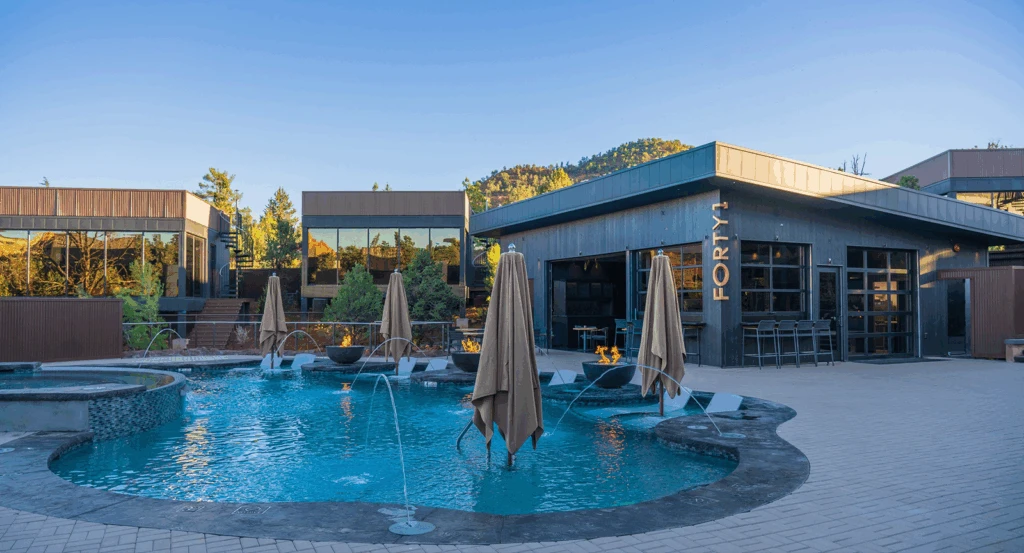 Crescent shaped pool at Ambiente surrounded by atrium suites.