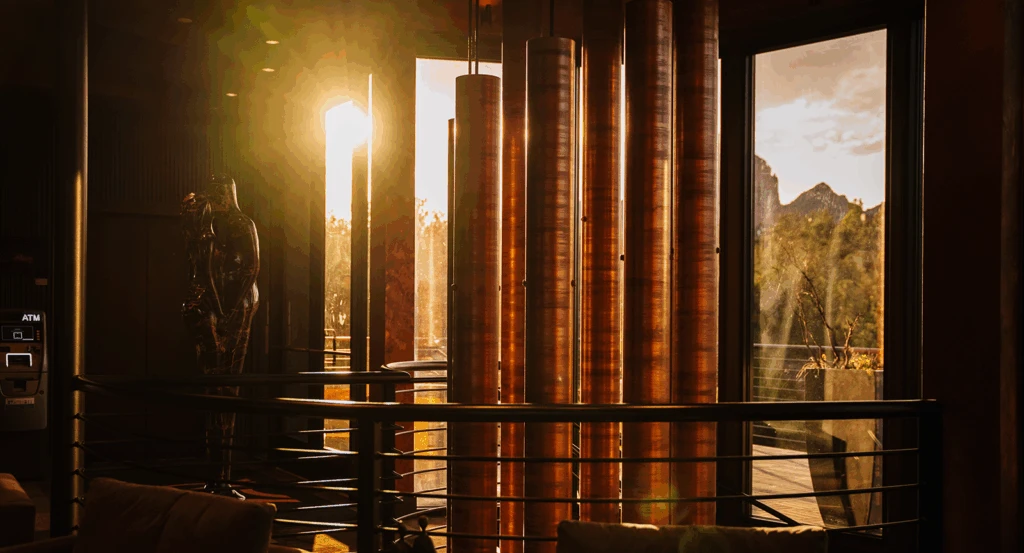 Sedona resort spa entrance wind chimes with the sun setting behind