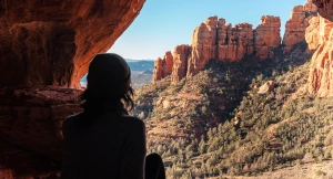 A hiker gazing out at the Sedona red rock landscape.