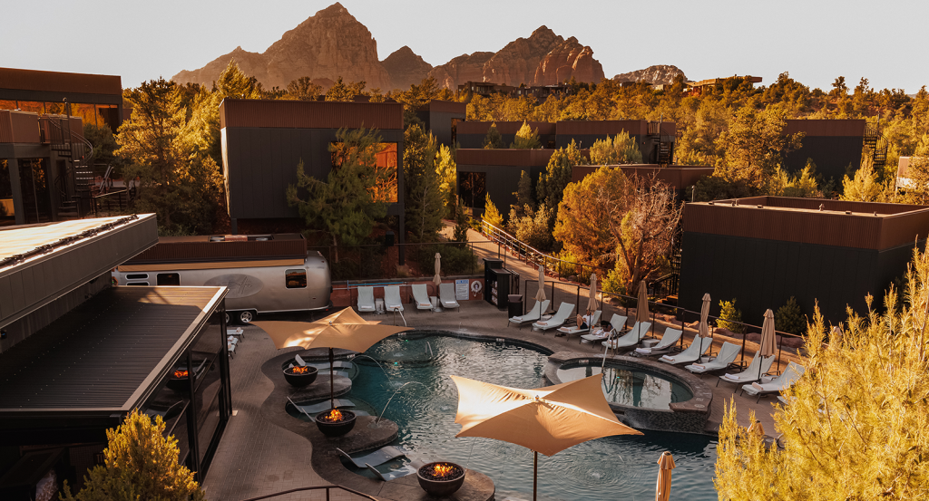 Ambiente's pool and surrounding atriums at sunset