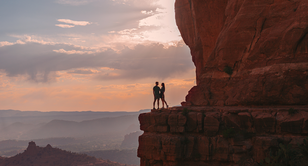 a couple on Cathedral Rock at sunrise