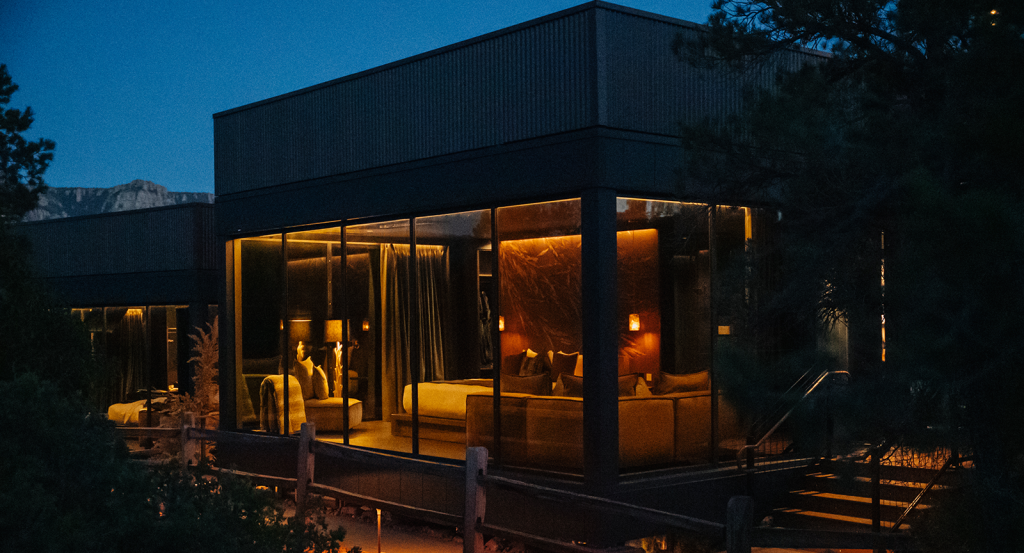 A private atrium suite at Ambiente lit up at night