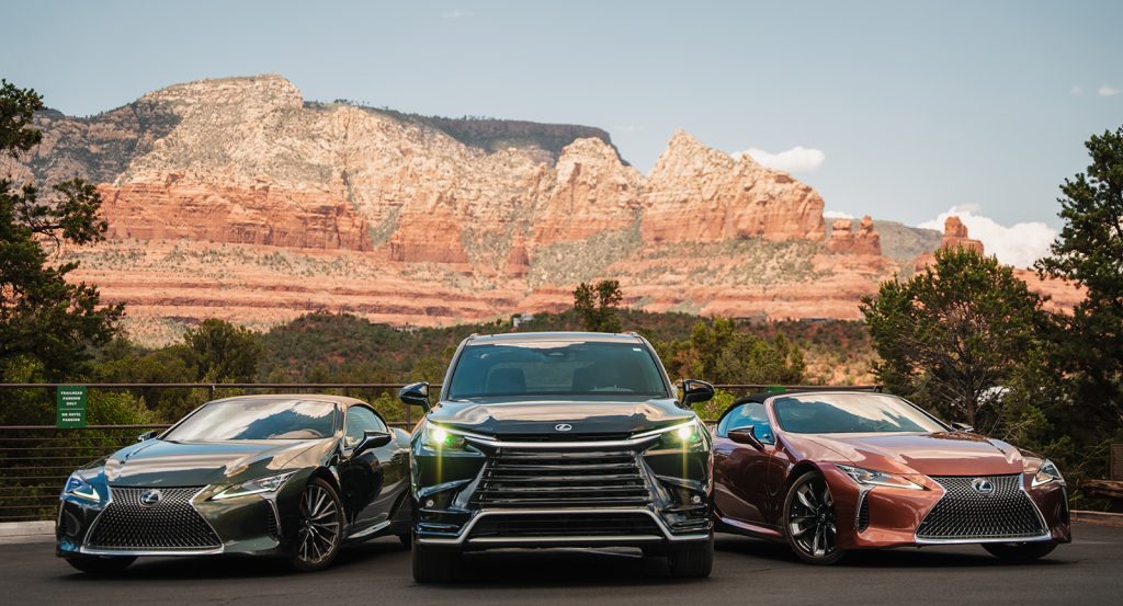 Ambiente's Destination by Lexus vehicles in front of red rocks
